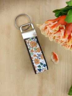 Porte clés cuir et tissu fleuri terracotta