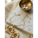 Bracelet doré avec perle nacrée baroque