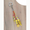 Bijou jaune pour licol ou sac