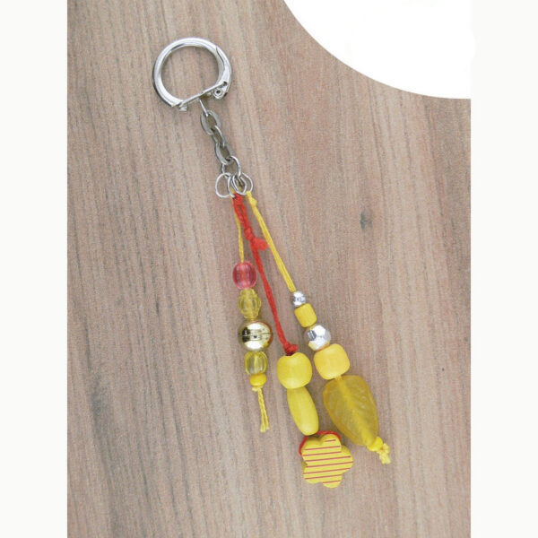 Bijou jaune pour licol ou sac