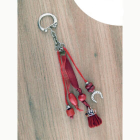 Bijou rouge pour licol ou sac