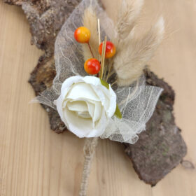 Boutonnière feuilles squelettes naturelle et rose
