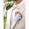 Boutonnière fleurs rose et bleue