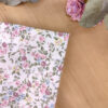 Pochette de costume dans les tons de rose et vert sauge