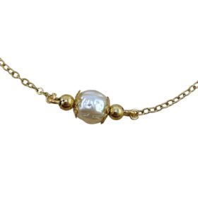 Collier de dos doré et perles baroques