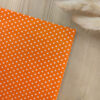 Pochette de costume orange à pois blancs